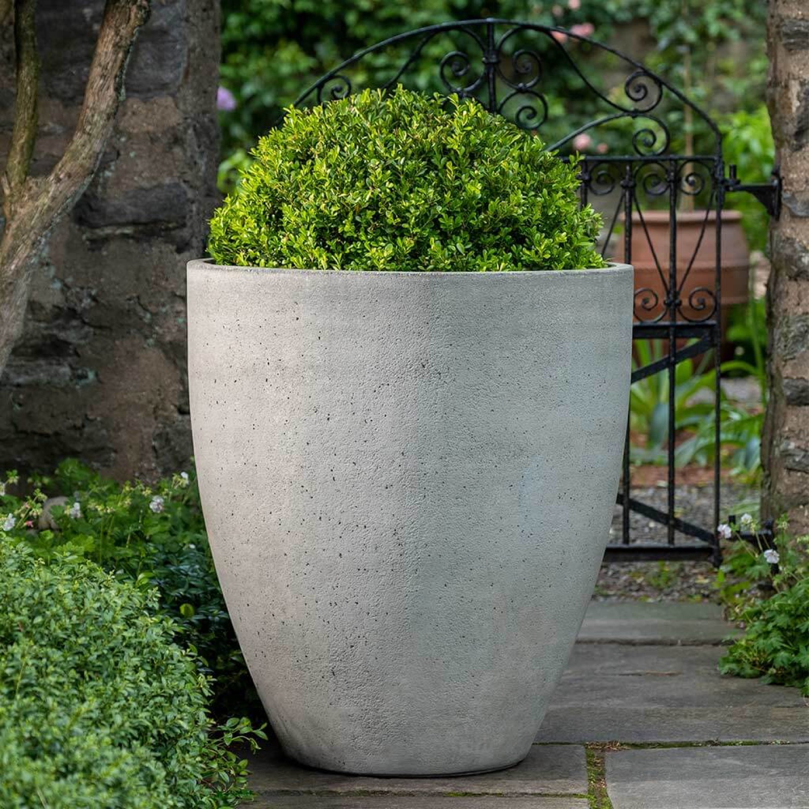Cast stone garden planter detail by Knäak Design Group